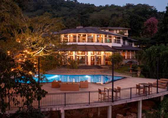 Resort building and pool at dusk